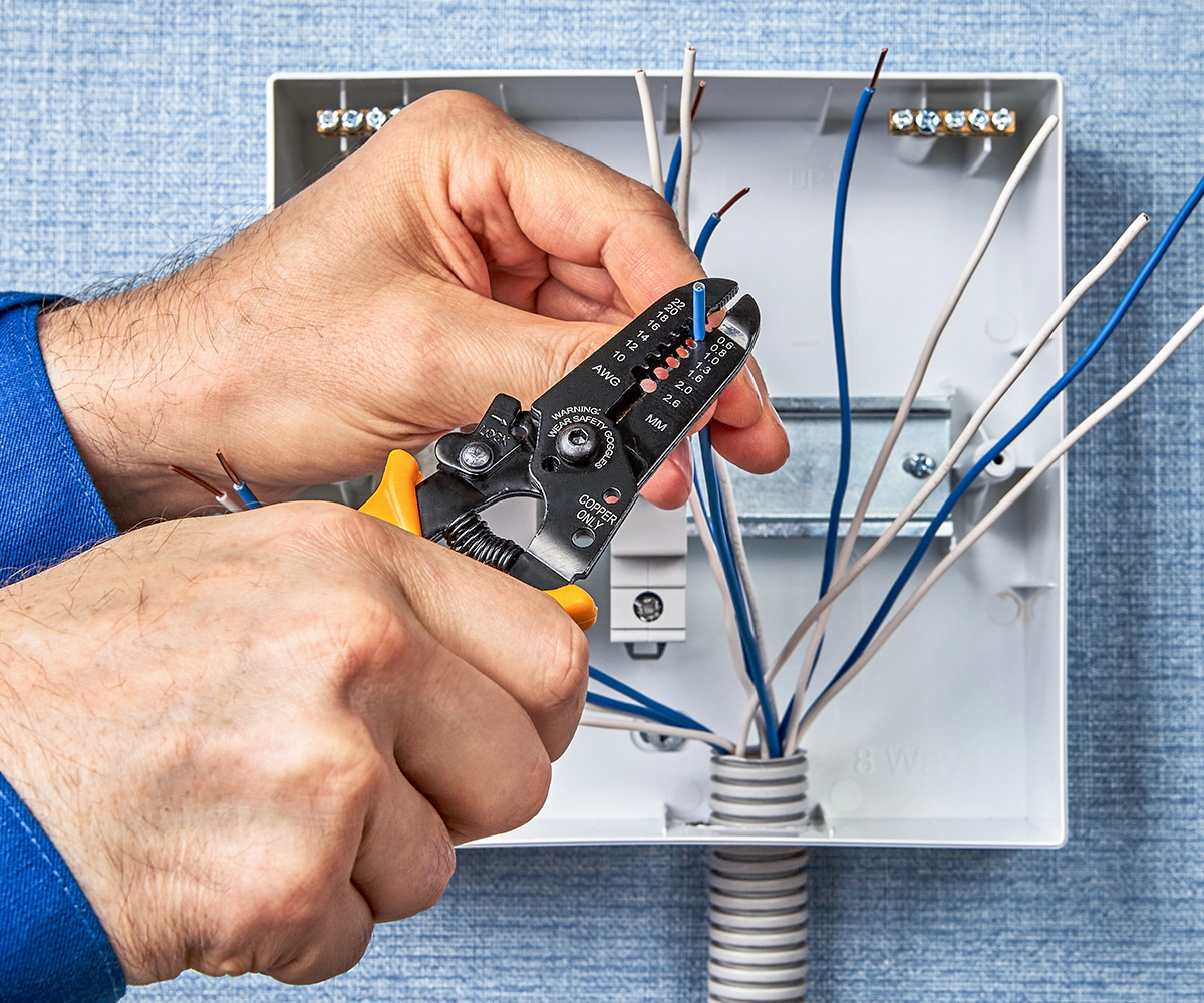 A person holding some wires in their hands